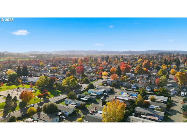 an aerial view of residential building and ocean