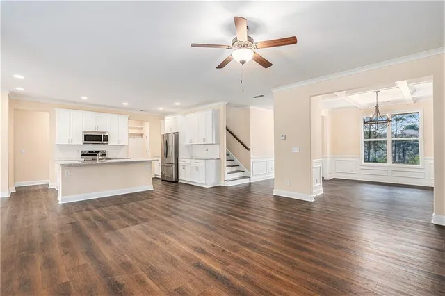 a view of kitchen with cabinets and wooden floor
