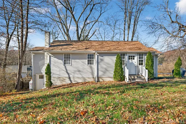 front view of a house with a yard
