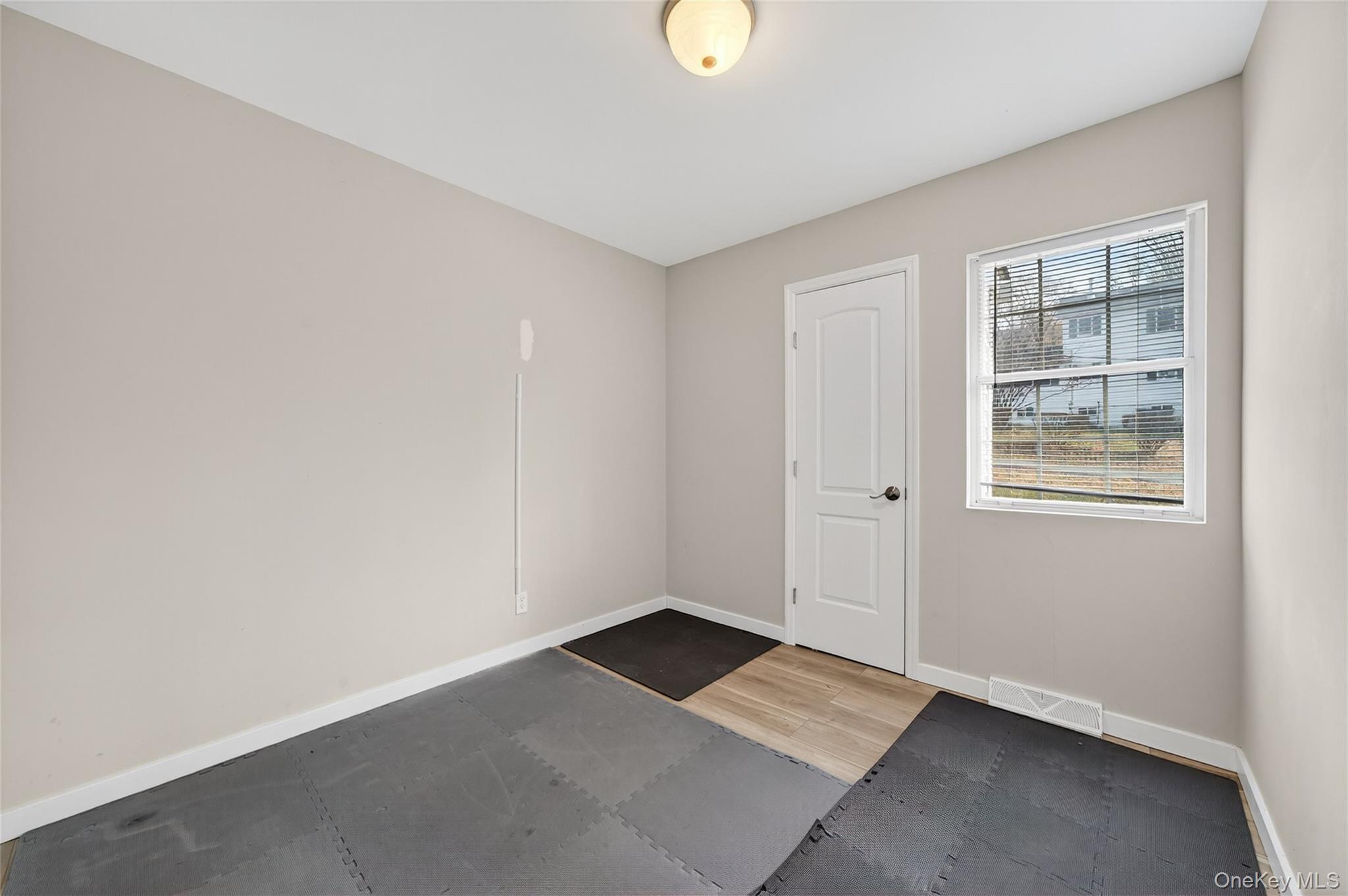 12 Revere Road Monroe, NY 10950 - Photo 27 of 30 Empty room with baseboards and light wood-style flooring