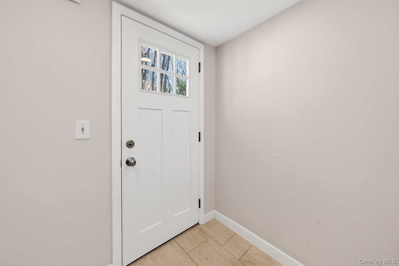 12 Revere Road Monroe, NY 10950 - Photo 3 of 30 Doorway with baseboards and tile patterned flooring