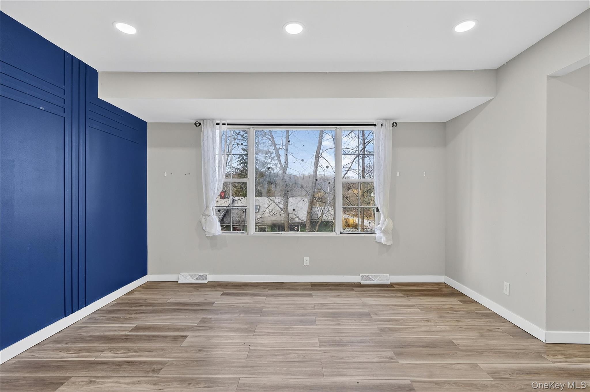 12 Revere Road Monroe, NY 10950 - Photo 8 of 30 Spare room featuring light wood-style floors and recessed lighting