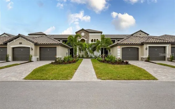 front view of a house with a garden