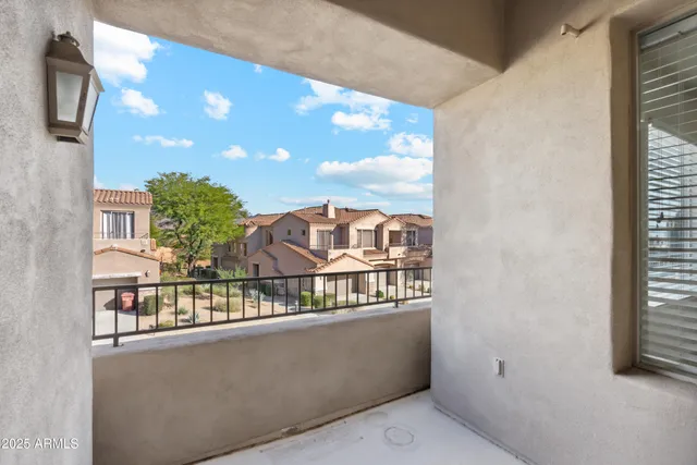 a view of a balcony with city view
