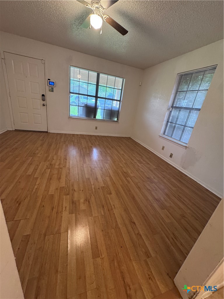 1301 North 10th Street Temple, TX 76501 - Photo 3 of 25 wooden floor in an empty room