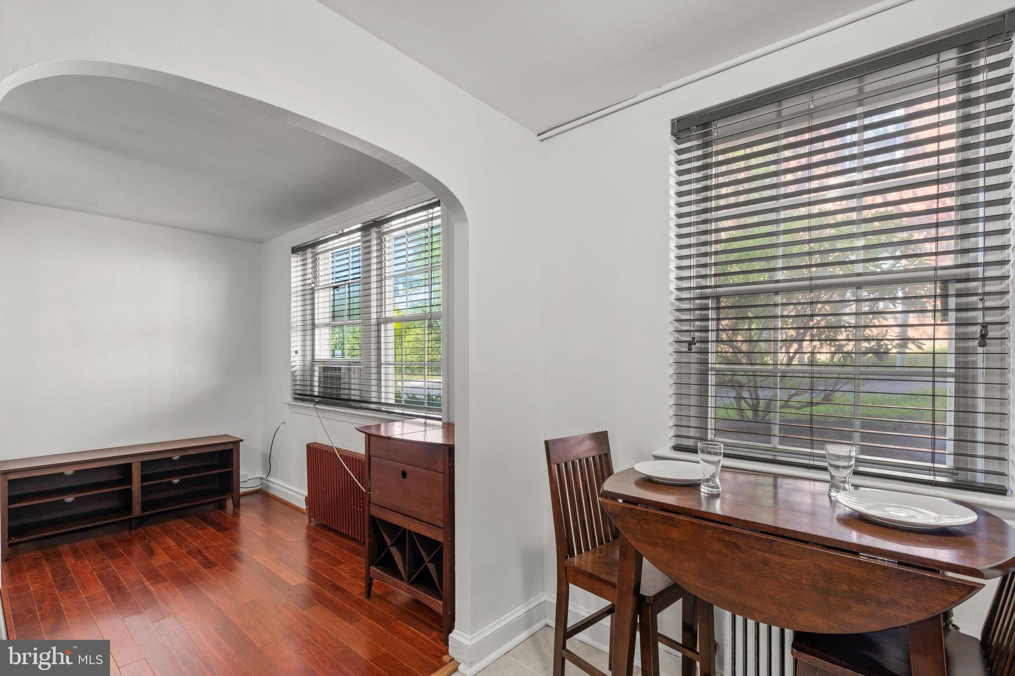 4581 MacArthur Boulevard Northwest, Unit 103 Washington, DC 20007 - Photo 15 of 28 a view of a workspace with furniture and a window