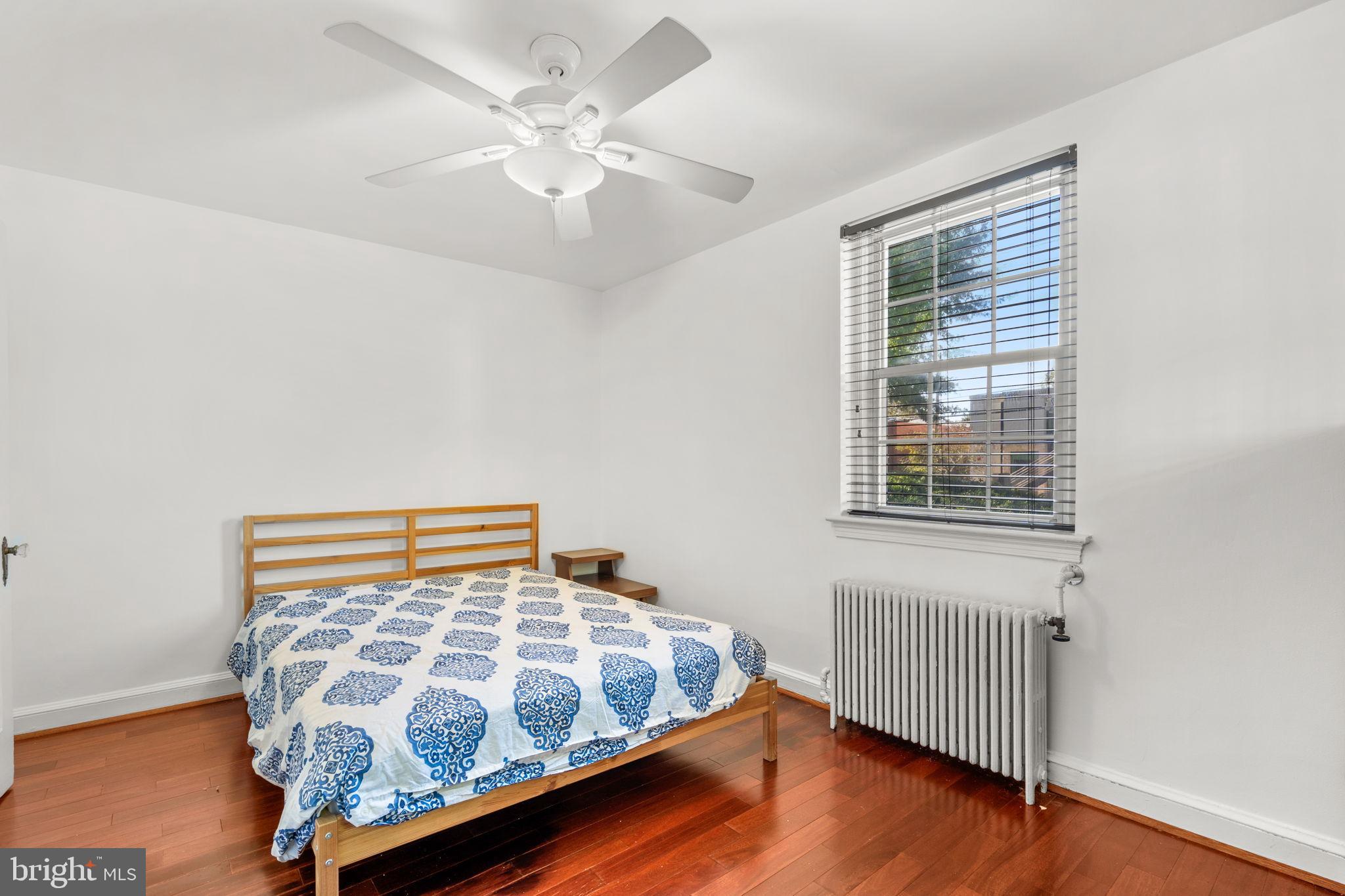 4581 MacArthur Boulevard Northwest, Unit 103 Washington, DC 20007 - Photo 16 of 28 a bedroom with a bed and a window