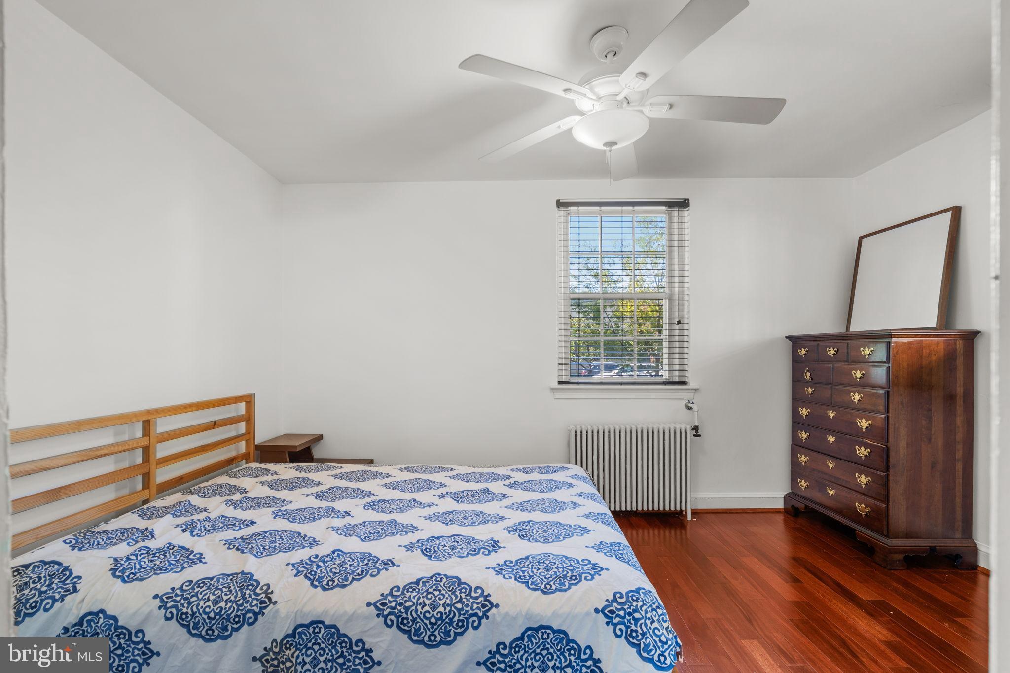 4581 MacArthur Boulevard Northwest, Unit 103 Washington, DC 20007 - Photo 17 of 28 a bedroom with a bed and a window