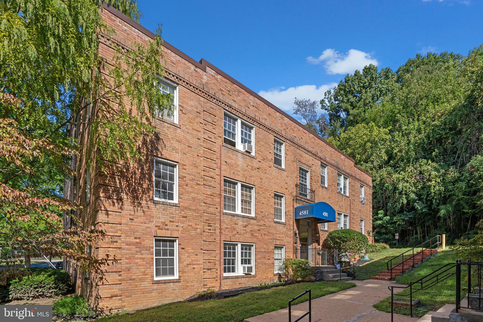 4581 MacArthur Boulevard Northwest, Unit 103 Washington, DC 20007 - Photo 27 of 28 a front view of a house with garden