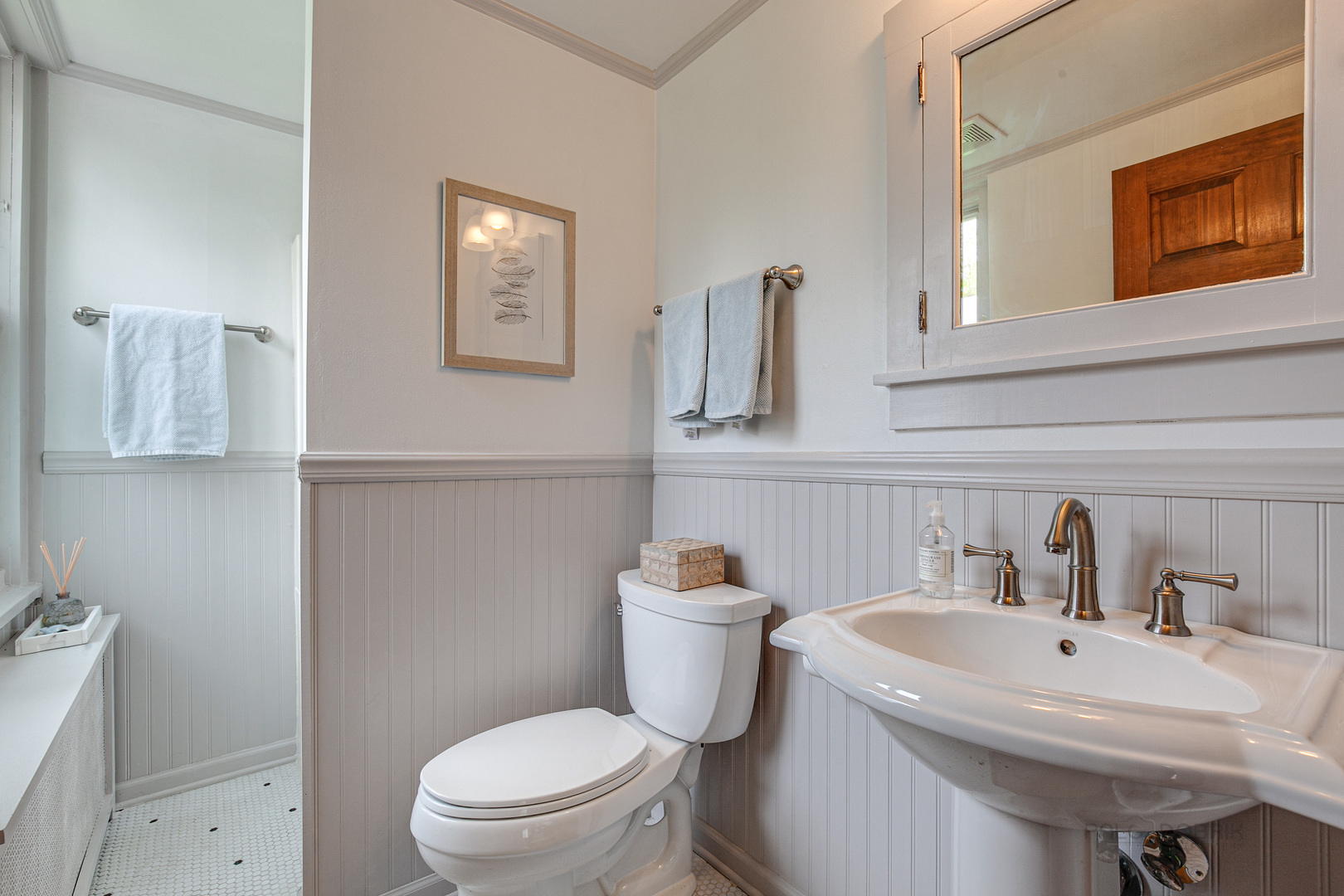 120 Atteridge Road Lake Forest, IL 60045 - Photo 11 of 26 a bathroom with a sink a toilet and mirror
