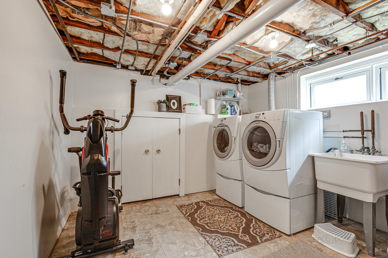 120 Atteridge Road Lake Forest, IL 60045 - Photo 22 of 26 a utility room with dryer washer and a view of living room