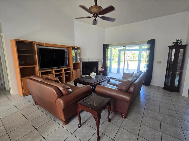an aerial view of a city with lots of residential buildings and mountain view in back
