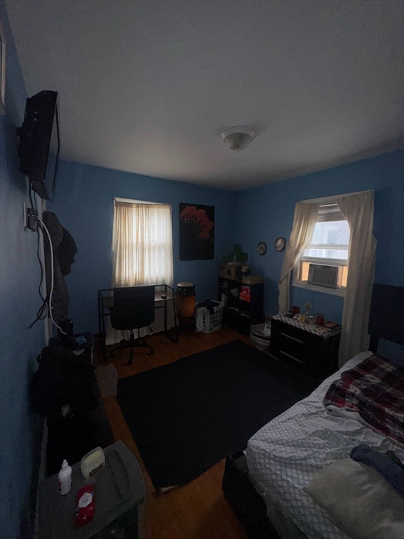 87 Exeter Street Lowell, MA 01850 - Photo 4 of 11 a bedroom with a bed window and dresser