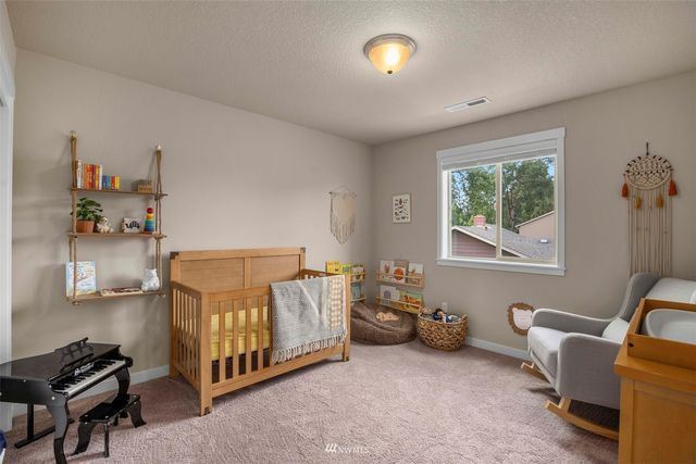 a bed room with furniture and a window