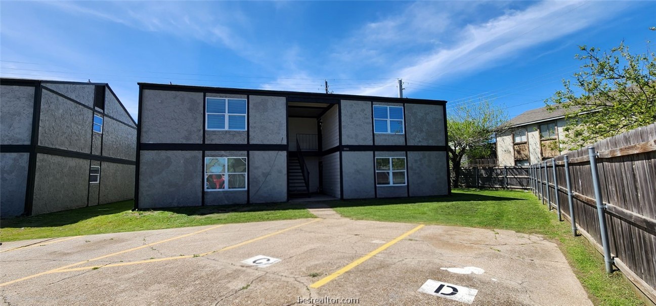 806 Oran Circle, Unit G Bryan, TX 77801 - Photo 24 of 25 a front view of a house with a garden