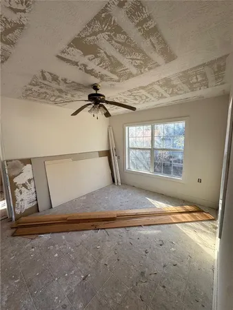 a view of a room with rack on the wall and a window