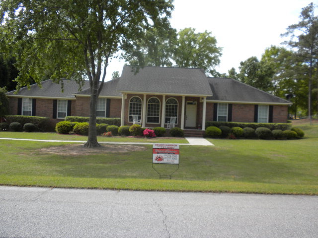 354 Old Oak Road, Unit 126 Macon, GA 31216 - Photo 1 of 13 a front view of a house with a yard table and chairs