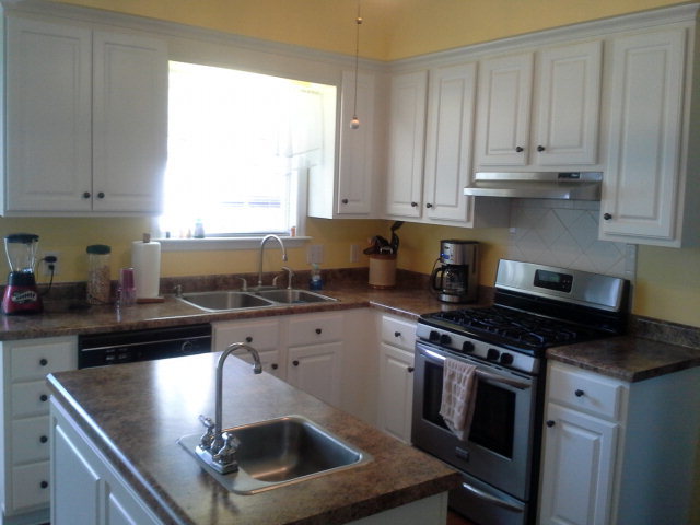 354 Old Oak Road, Unit 126 Macon, GA 31216 - Photo 5 of 13 a kitchen with granite countertop a stove sink and cabinets