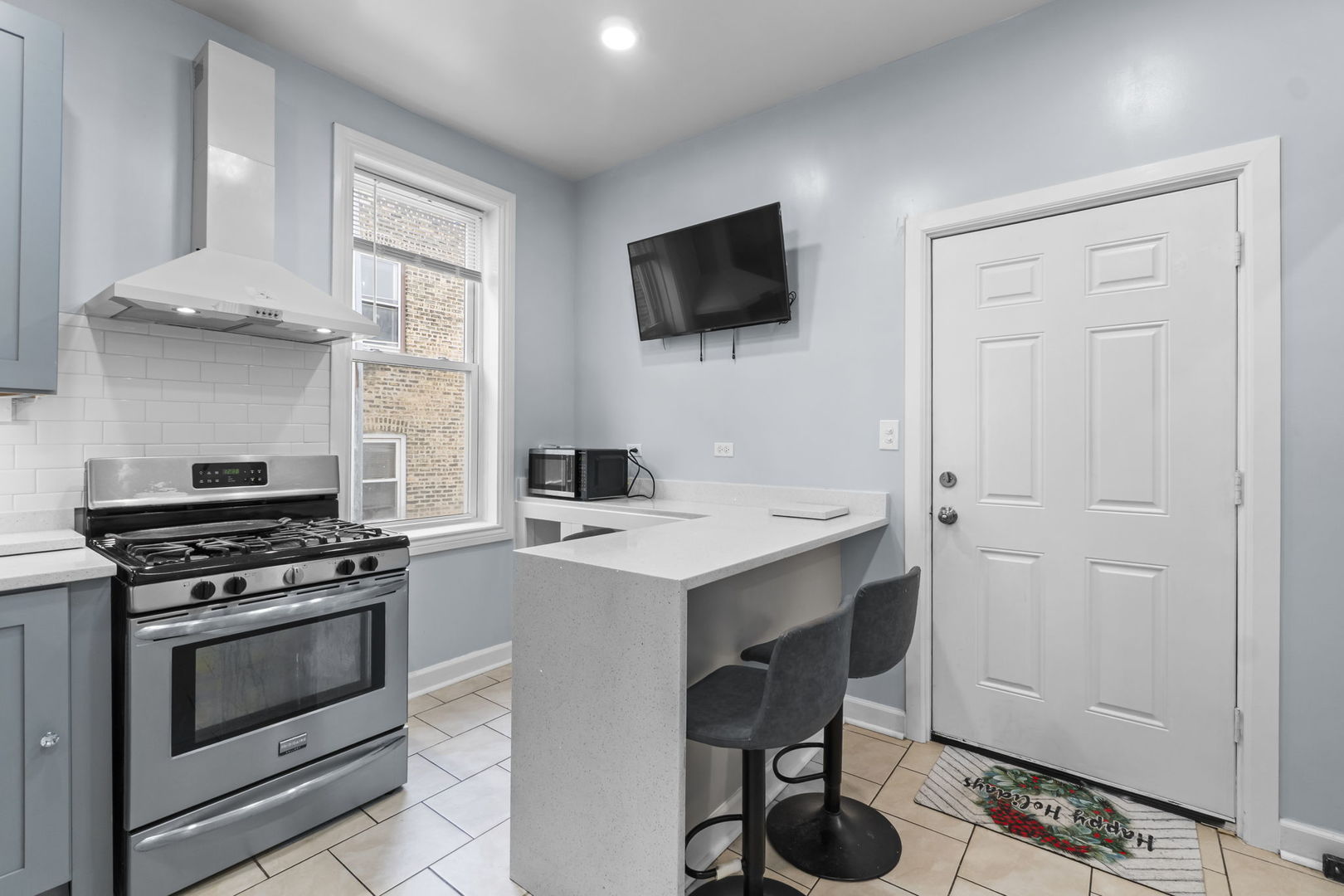 4920 West Iowa Street Chicago, IL 60651 - Photo 13 of 33 a kitchen with a stove and a microwave