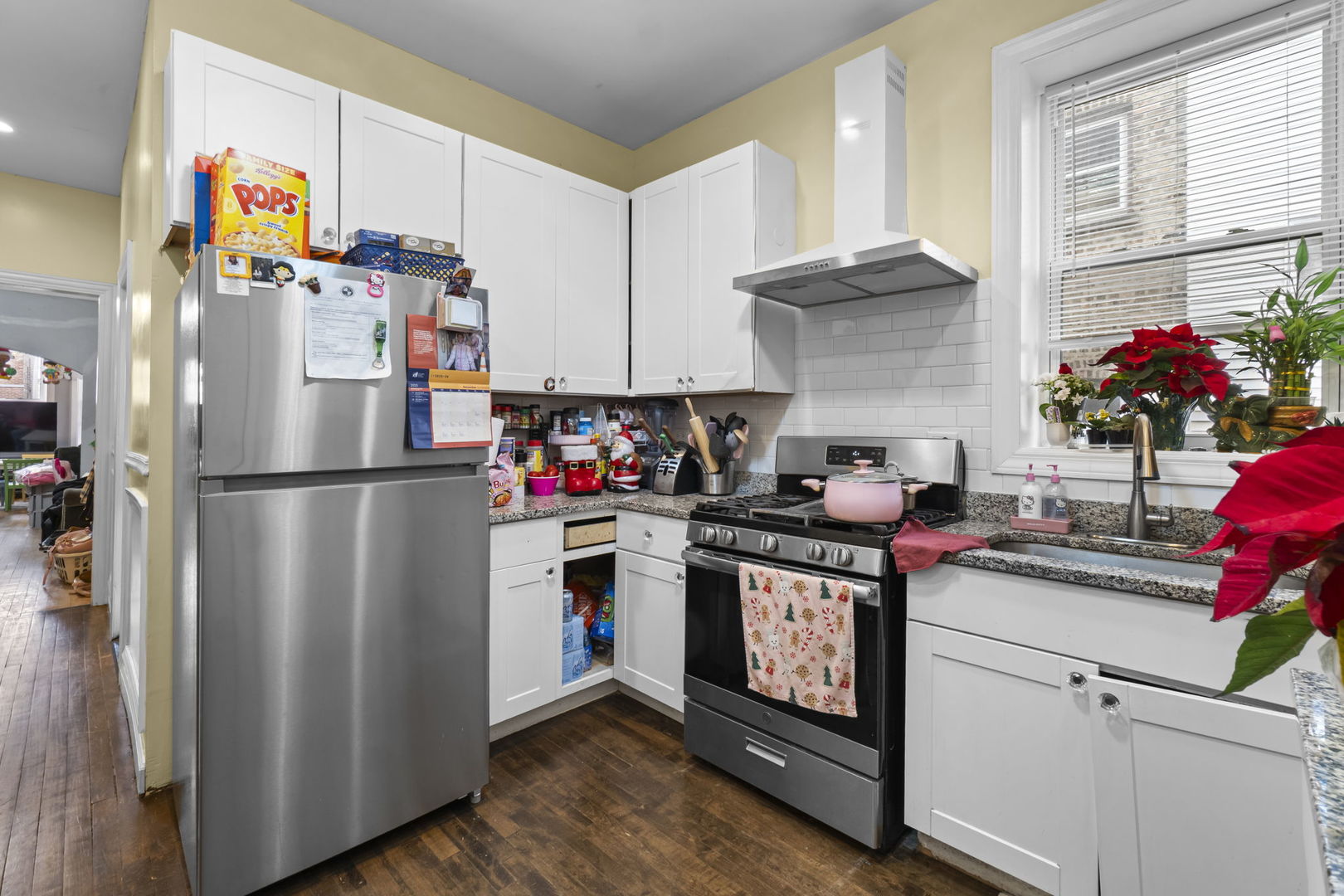 4920 West Iowa Street Chicago, IL 60651 - Photo 23 of 33 a kitchen with a refrigerator and a stove top oven