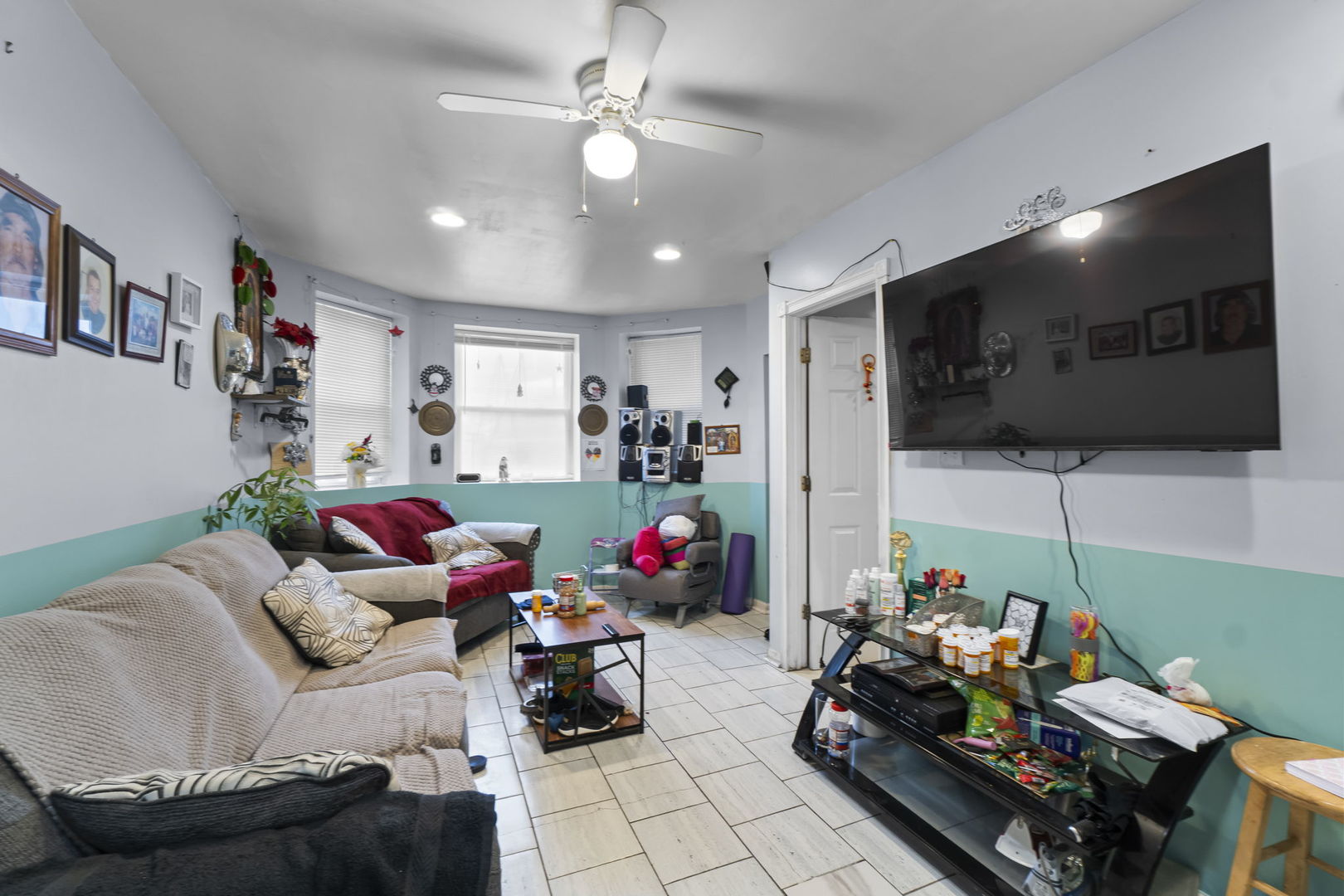 4920 West Iowa Street Chicago, IL 60651 - Photo 25 of 33 a living room with furniture and a flat screen tv
