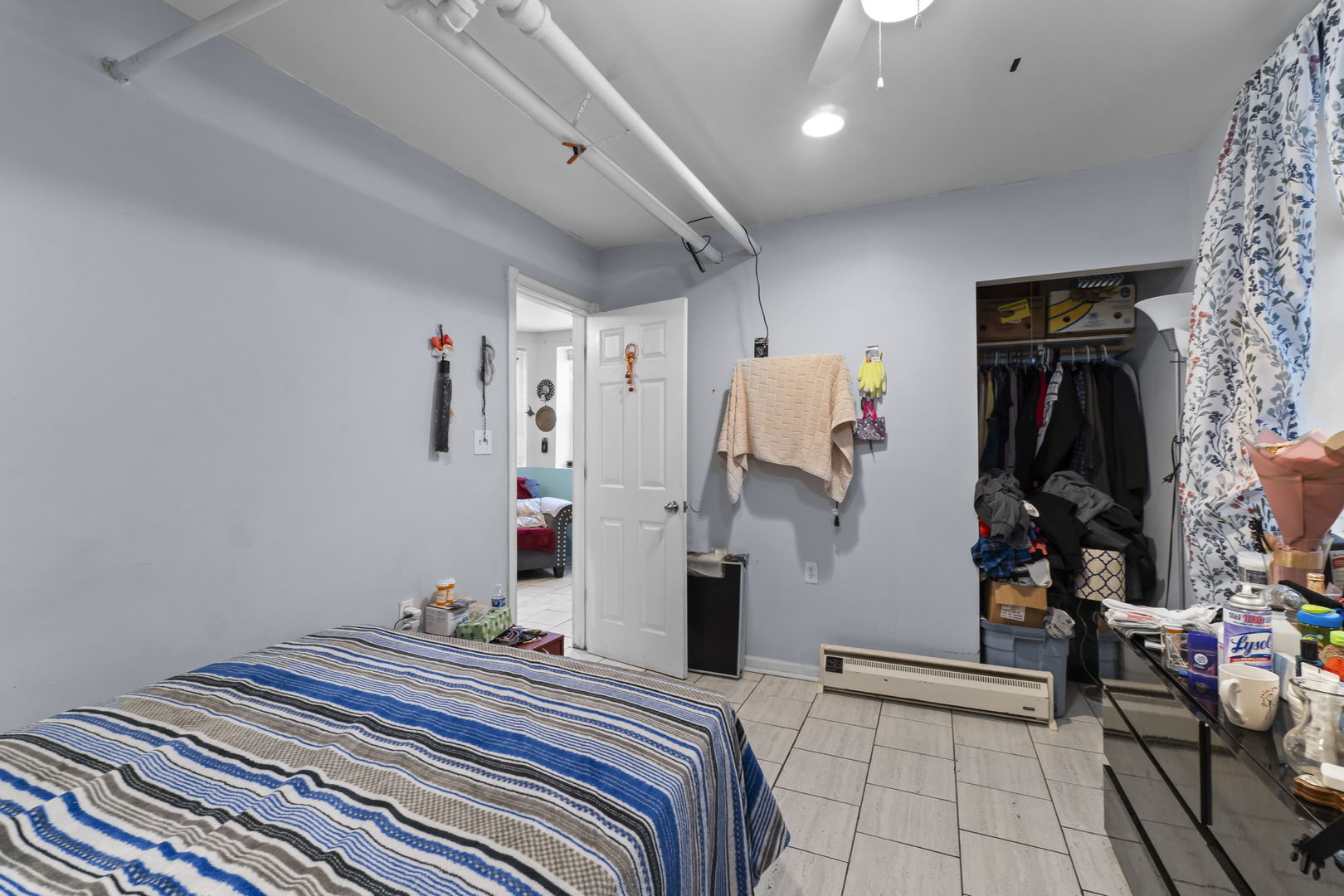 4920 West Iowa Street Chicago, IL 60651 - Photo 29 of 33 a bedroom with a bed and a walk in closet