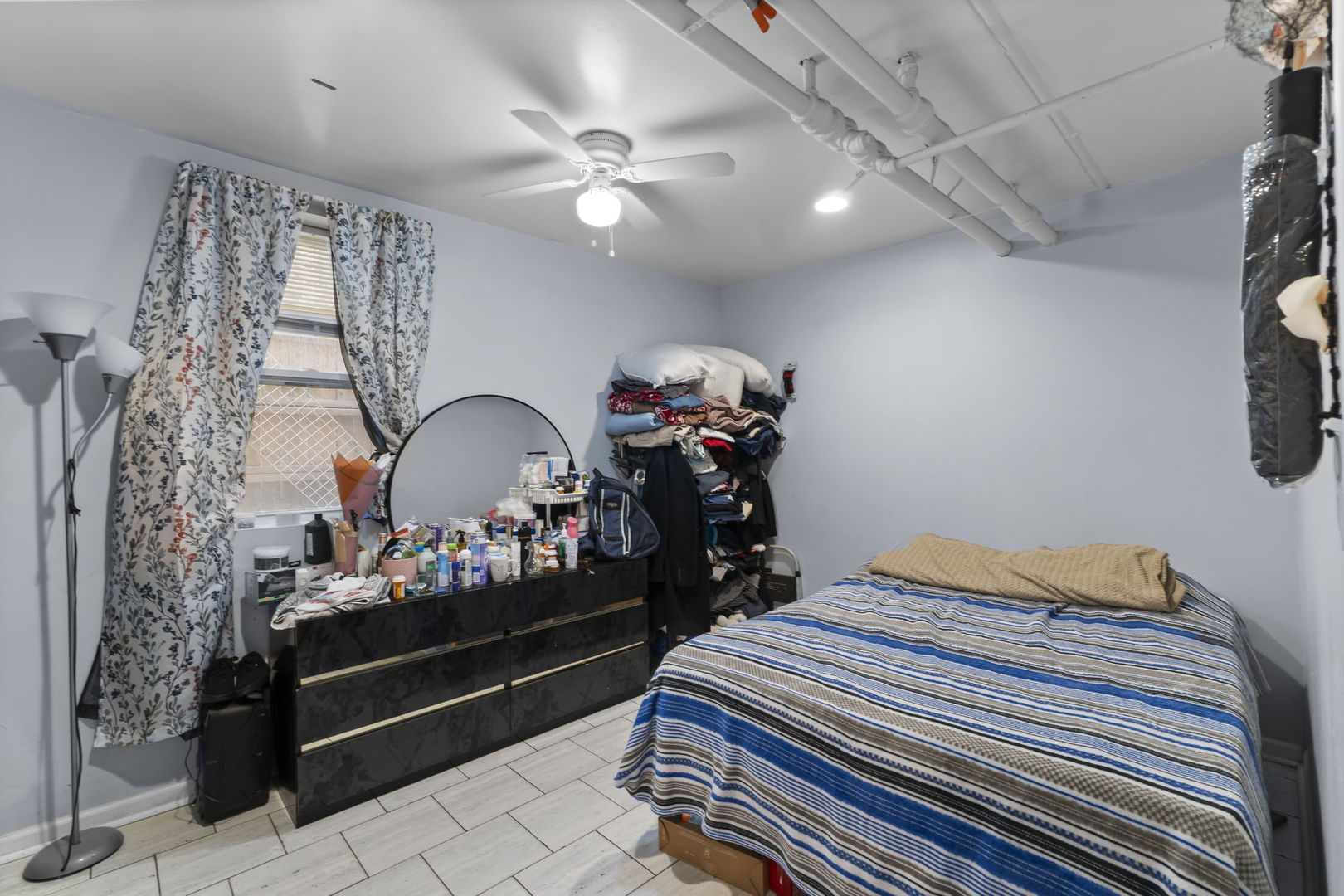 4920 West Iowa Street Chicago, IL 60651 - Photo 30 of 33 a bedroom with a bed and a dresser