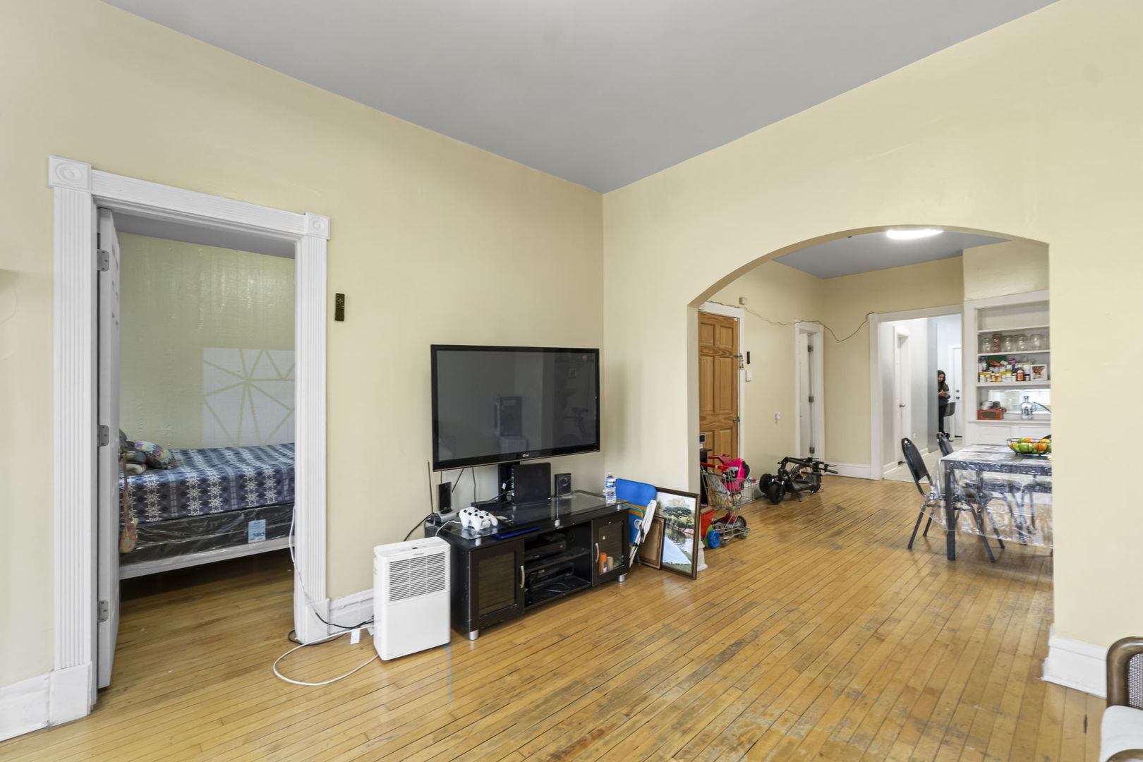4920 West Iowa Street Chicago, IL 60651 - Photo 3 of 33 a living room with furniture and a flat screen tv