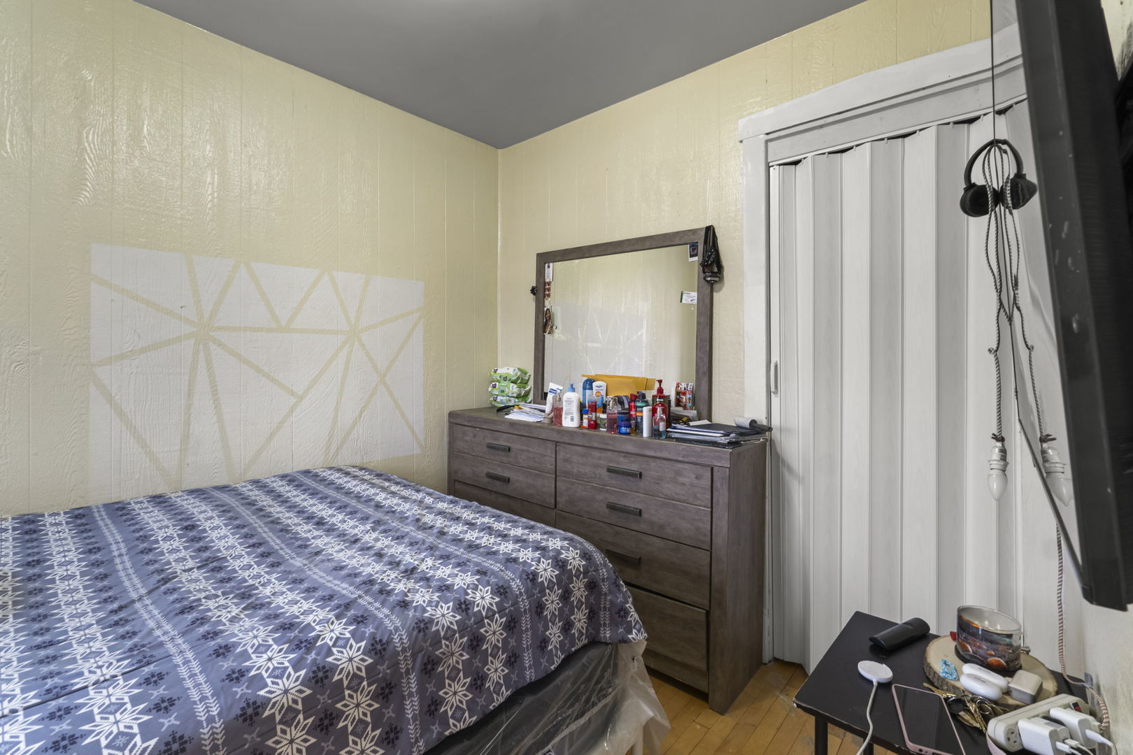 4920 West Iowa Street Chicago, IL 60651 - Photo 4 of 33 a bedroom with a bed and a mirror on dresser