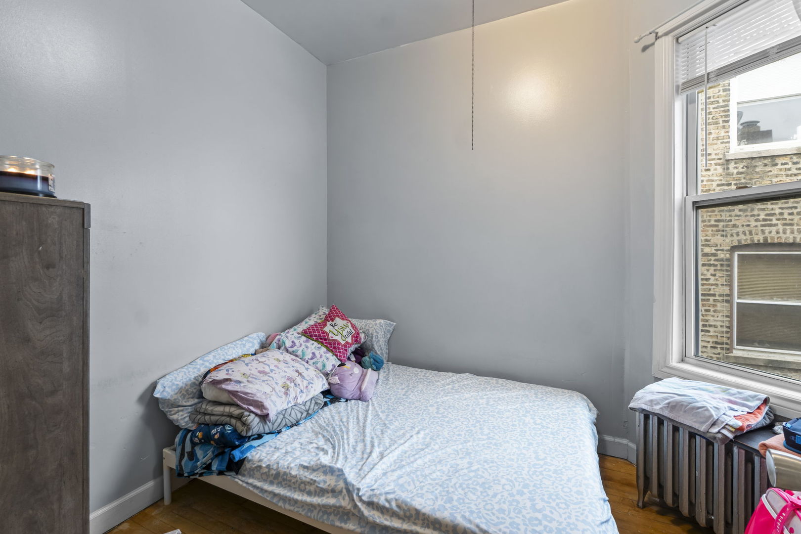 4920 West Iowa Street Chicago, IL 60651 - Photo 8 of 33 a bedroom with a bed and a window