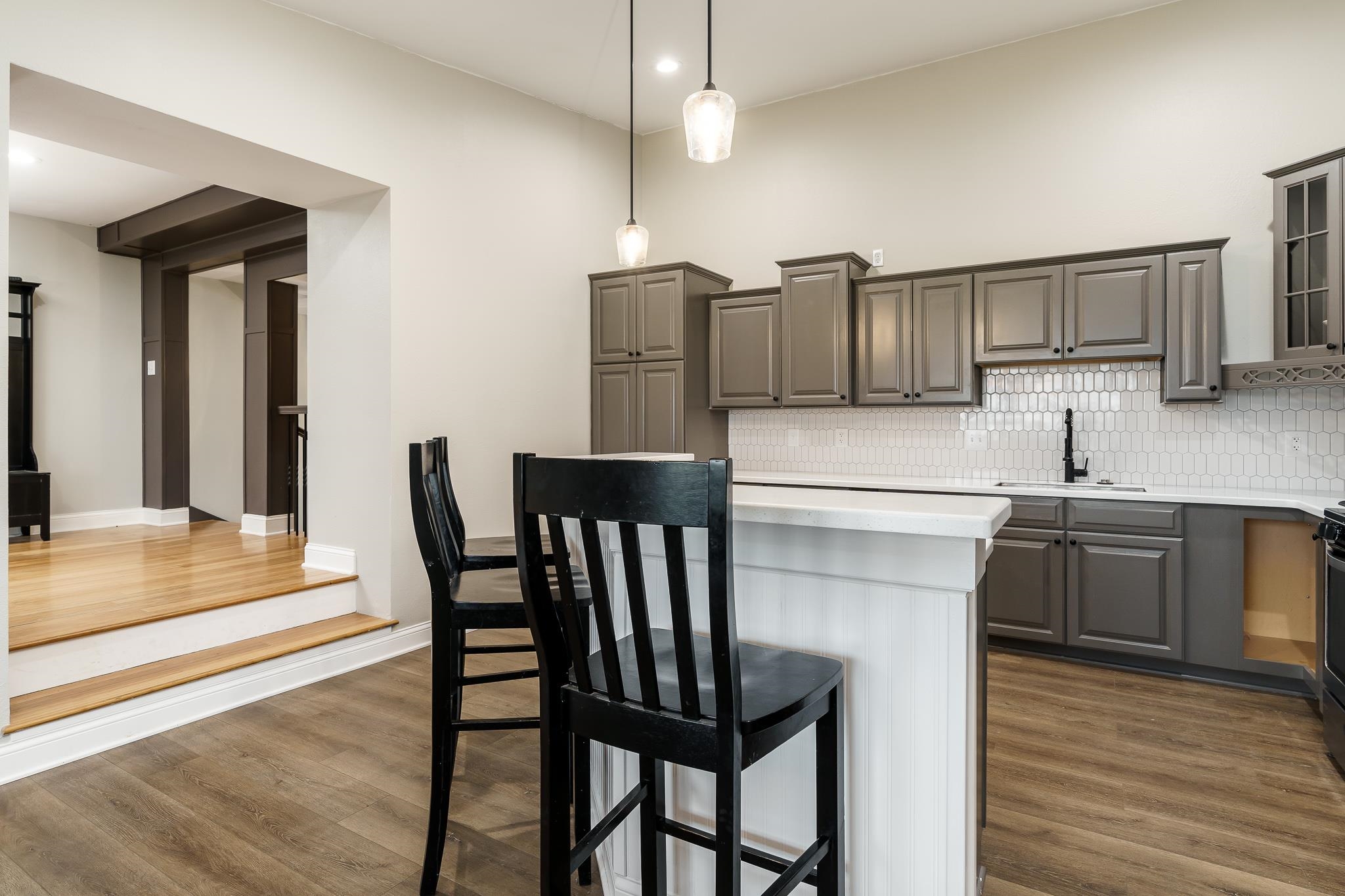 15026 Prairie Road South Beloit, IL 61080 - Photo 16 of 64 a kitchen with a dining table chairs cabinets and stainless steel appliances