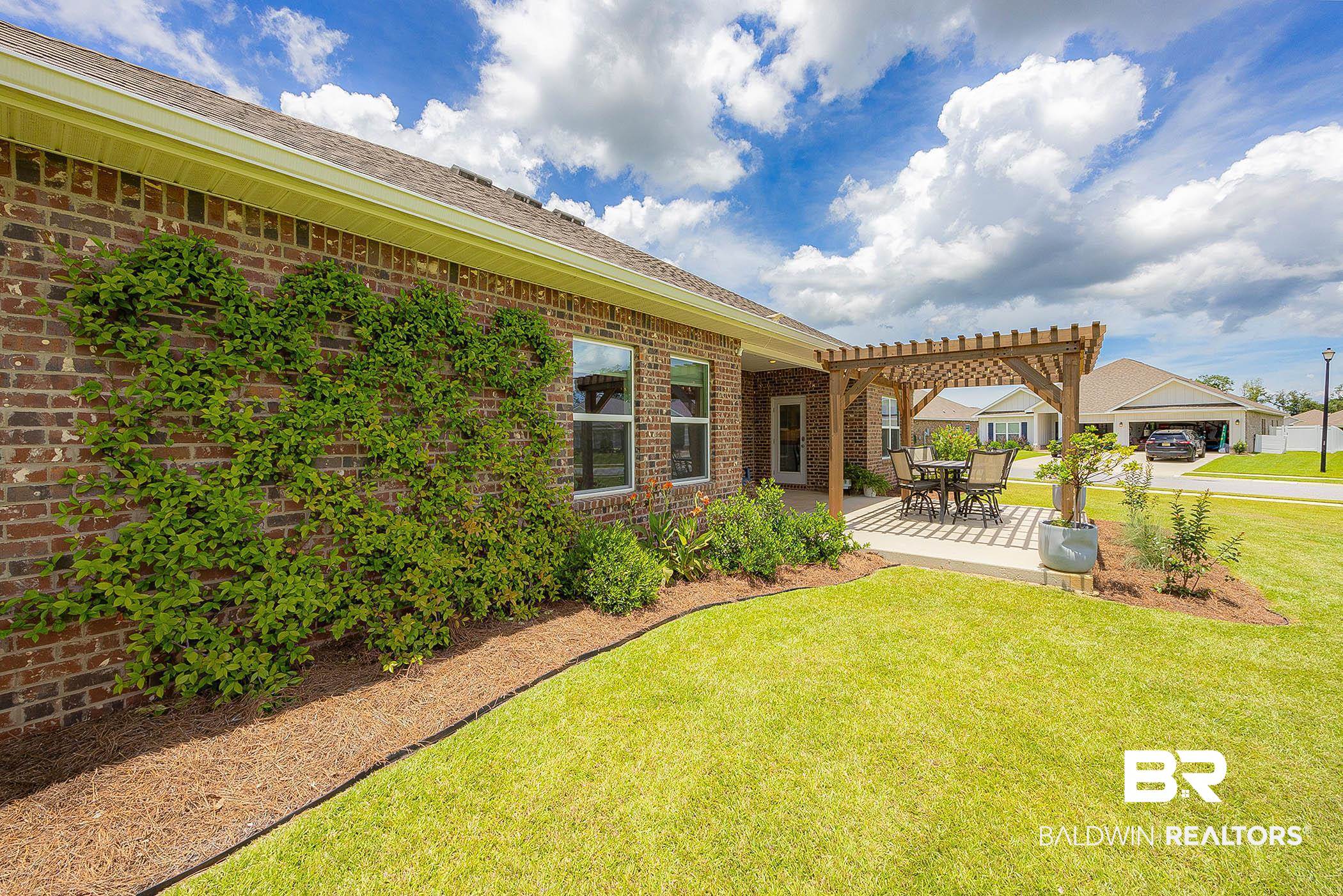 11044 Native Dancer Way Daphne, AL 36526 - Photo 41 of 67 View of yard with a pergola