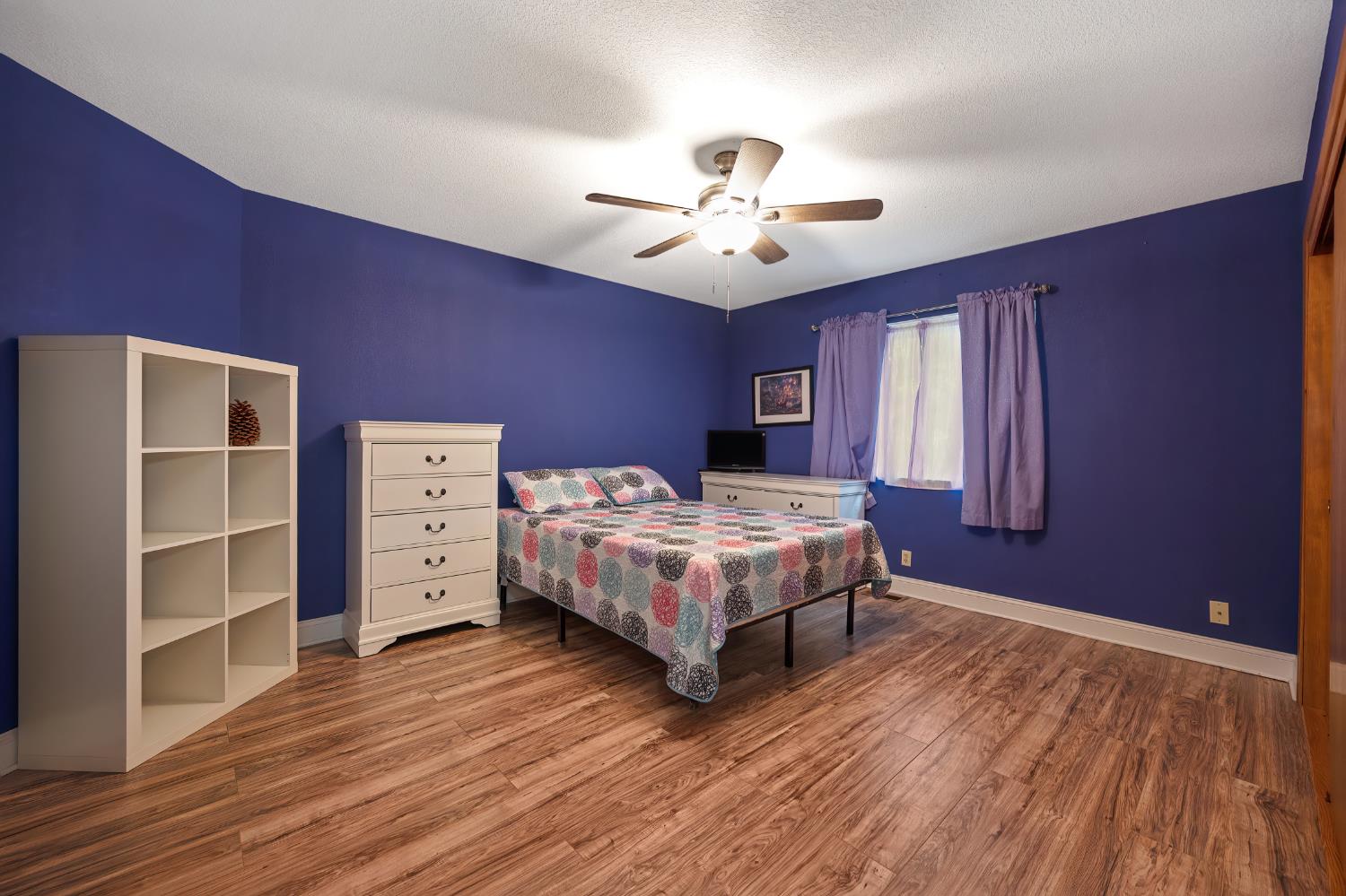 4580 Jenkinson Circle Pollock Pines, CA 95726 - Photo 18 of 78 a bedroom with a bed closet and a window