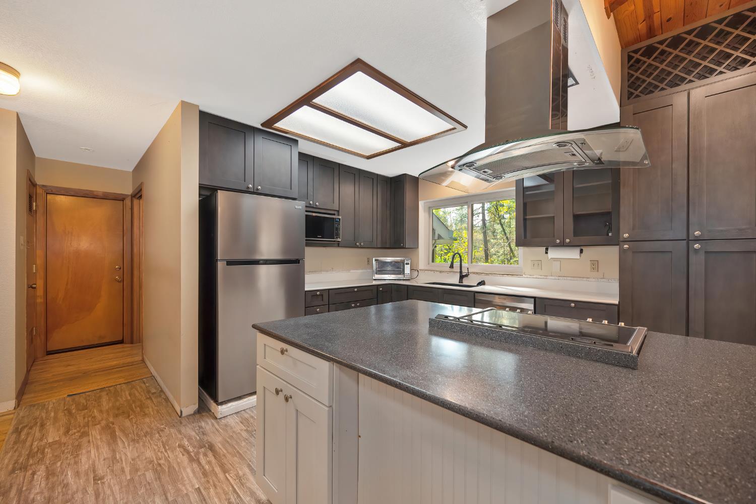 4580 Jenkinson Circle Pollock Pines, CA 95726 - Photo 37 of 78 a kitchen with stainless steel appliances granite countertop a refrigerator a sink and a stove