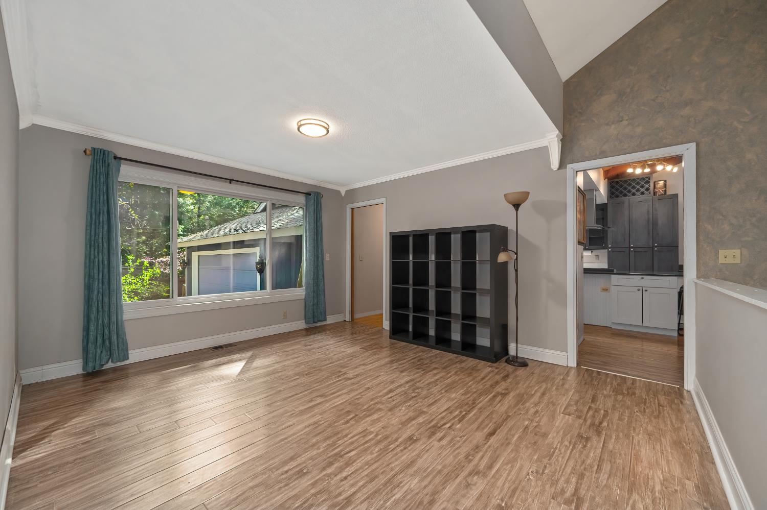 4580 Jenkinson Circle Pollock Pines, CA 95726 - Photo 41 of 78 wooden floor in an empty room with a window