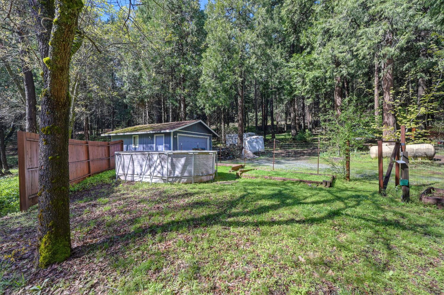 4580 Jenkinson Circle Pollock Pines, CA 95726 - Photo 69 of 78 a backyard of a house with seating space
