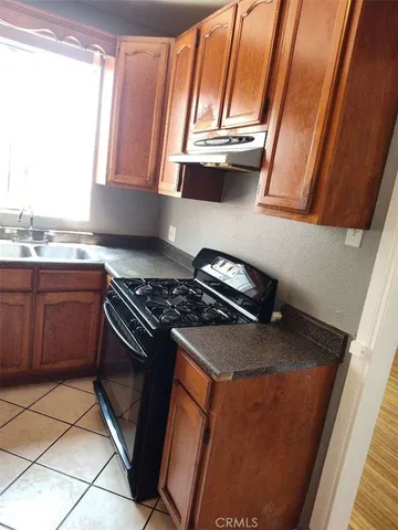 a kitchen with a stove and a microwave