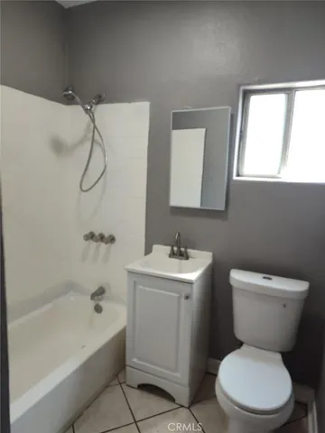 a bathroom with a toilet sink and bathtub