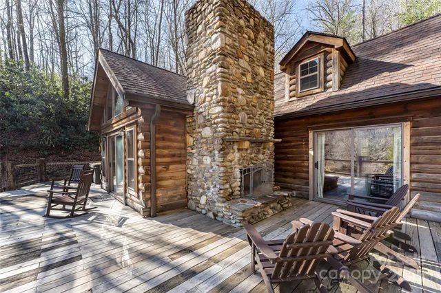 a view of house with backyard outdoor seating area