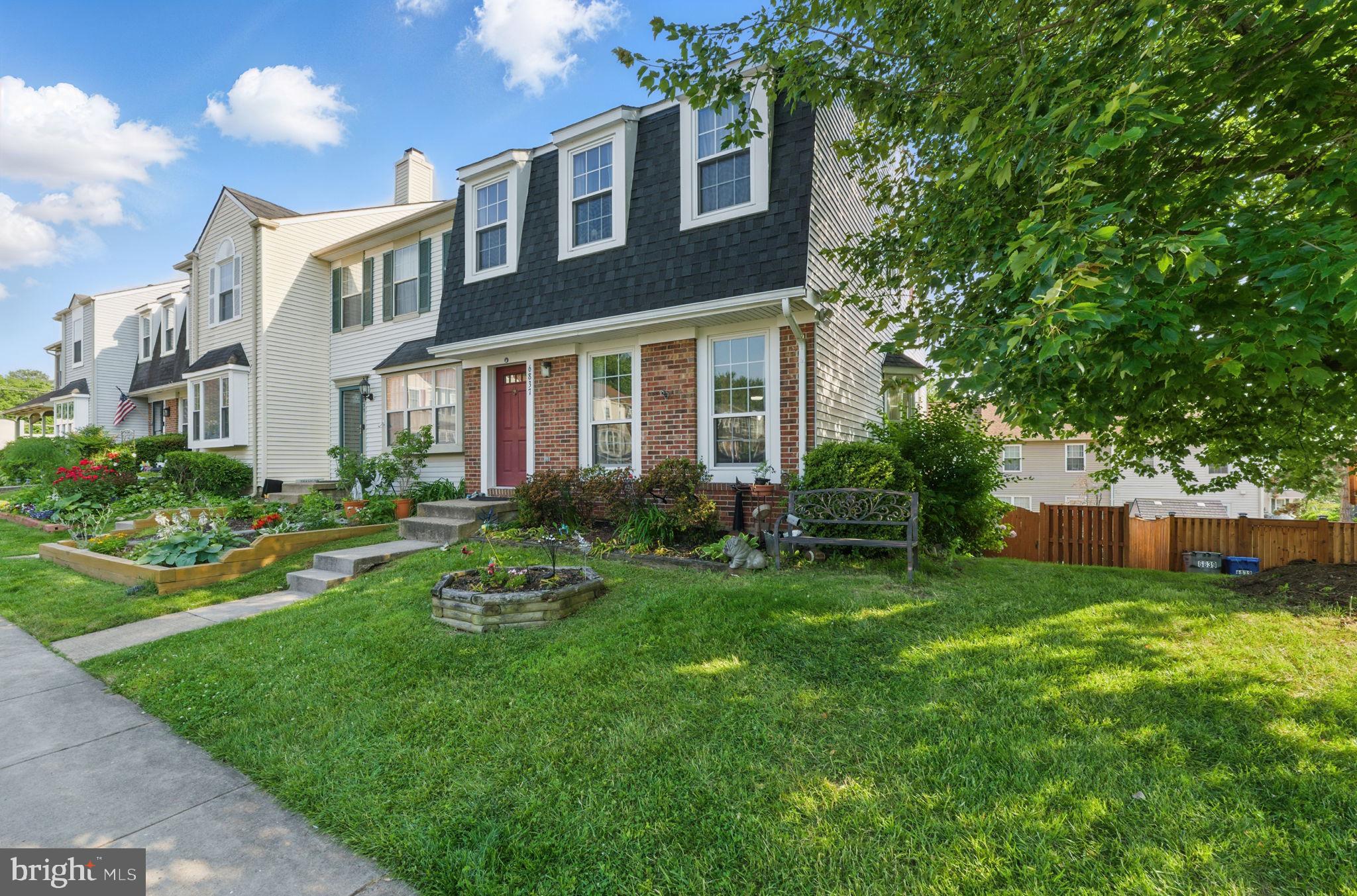6837 Cottingham Lane Centreville, VA 20121 - Photo 2 of 25 a view of a house with a yard and sitting area