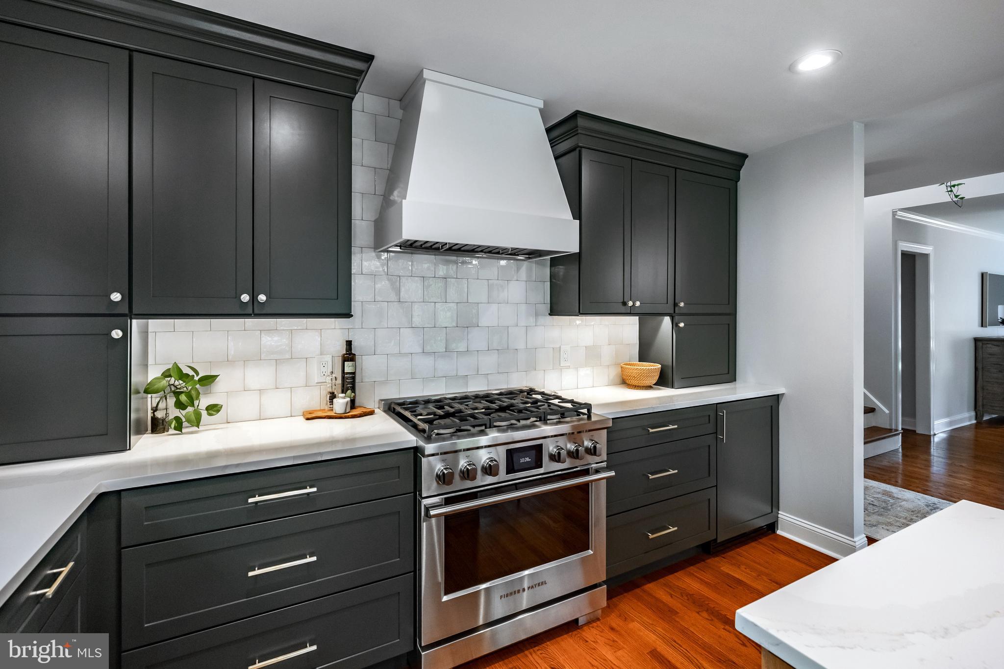 65 Roberts Road Newtown Square, PA 19073 - Photo 15 of 53 a kitchen with a stove and a cabinets