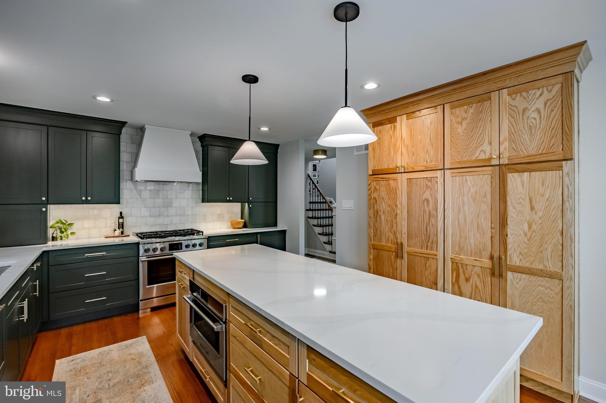 65 Roberts Road Newtown Square, PA 19073 - Photo 17 of 53 a kitchen with stainless steel appliances granite countertop a stove a sink island and a refrigerator