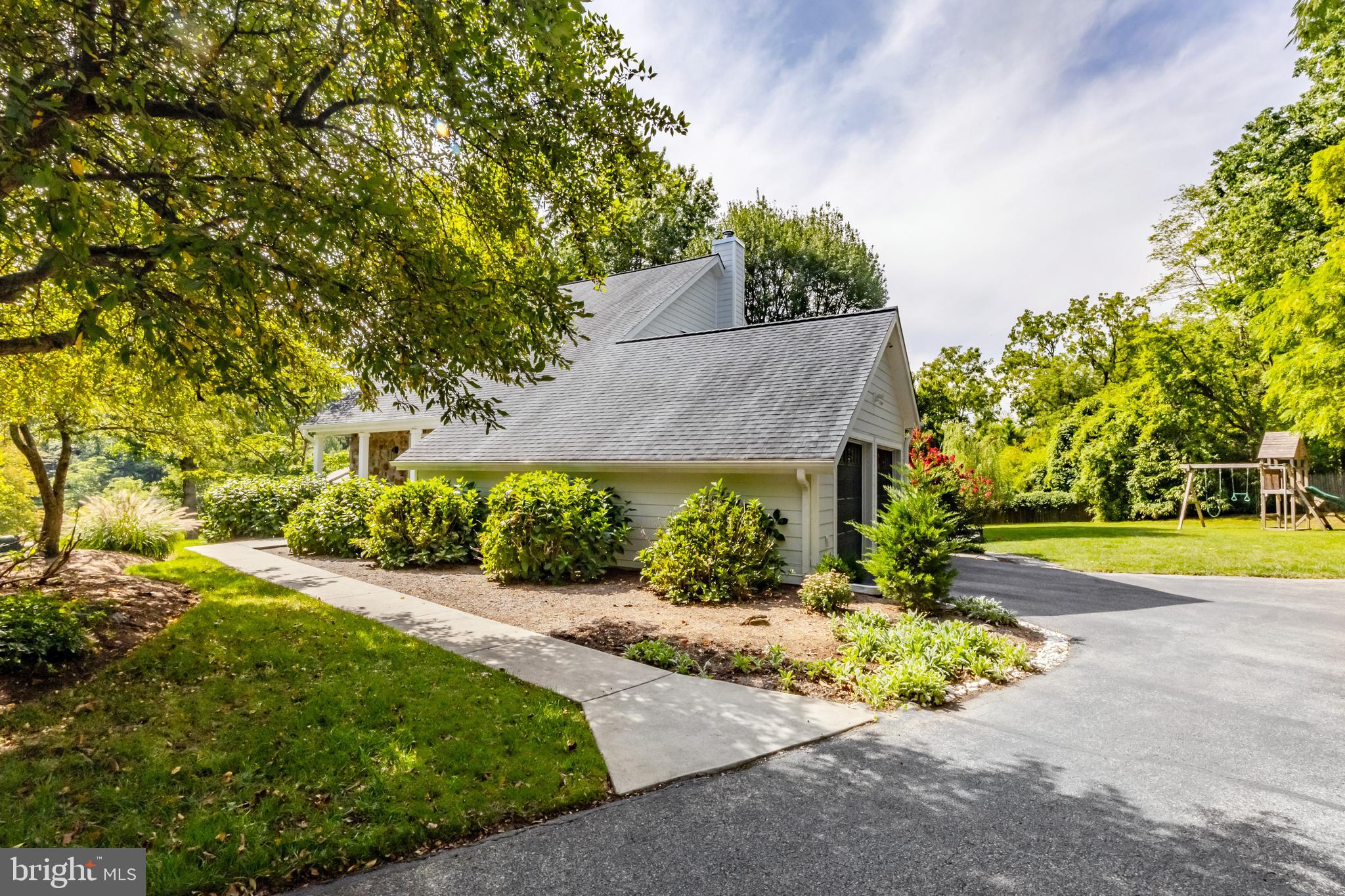65 Roberts Road Newtown Square, PA 19073 - Photo 2 of 53 front view of a house with a yard