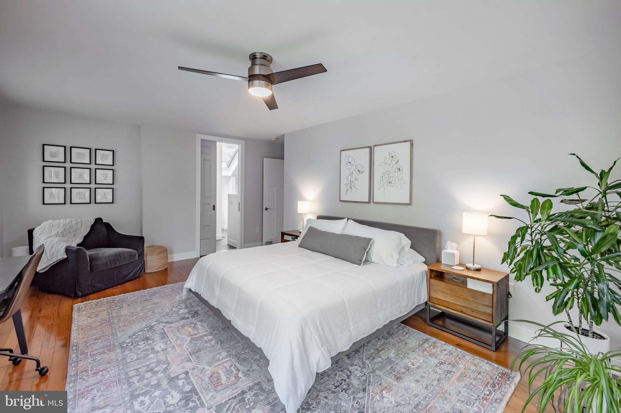 65 Roberts Road Newtown Square, PA 19073 - Photo 29 of 53 a bedroom with a bed a couch and potted plant
