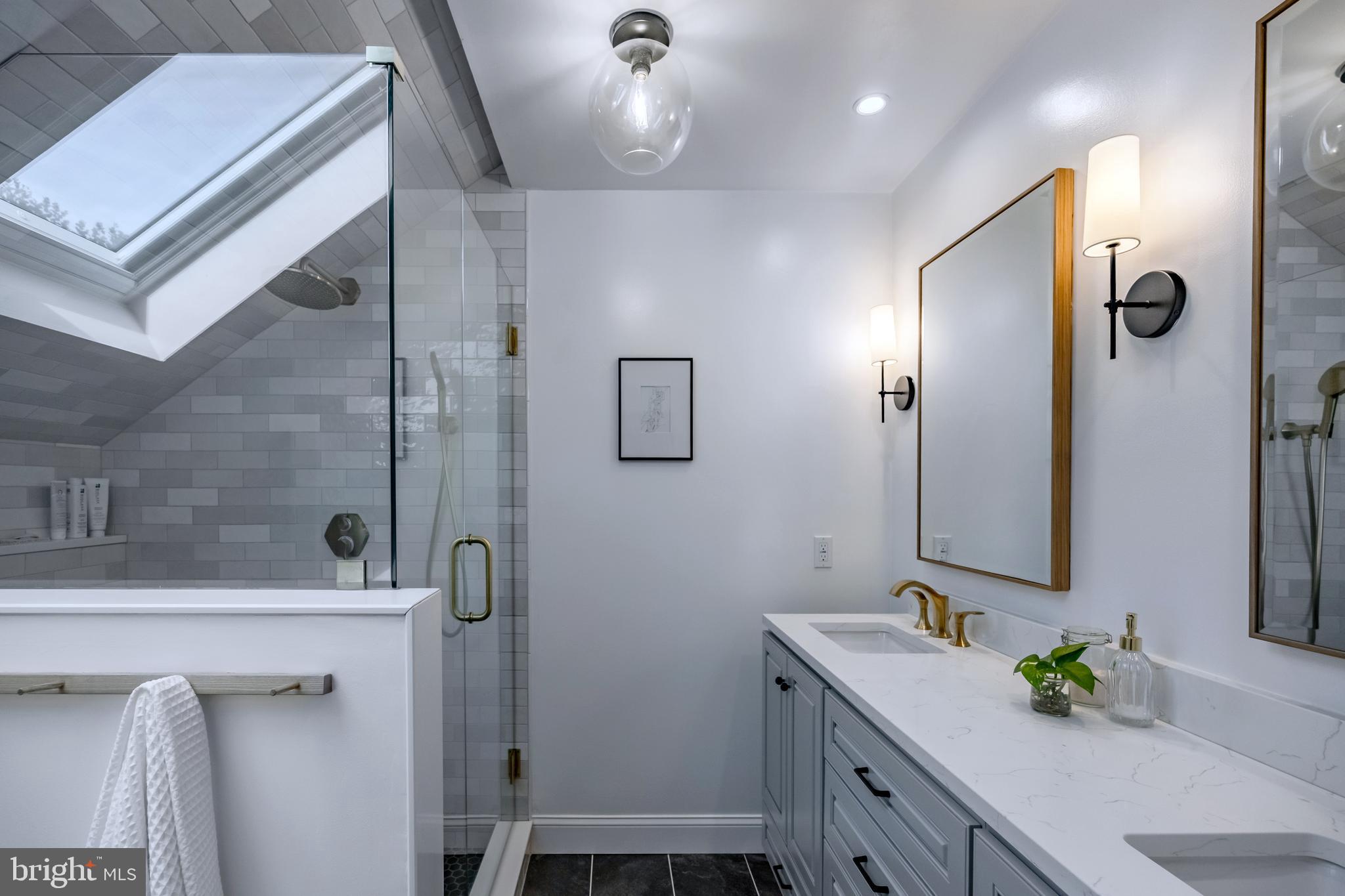 65 Roberts Road Newtown Square, PA 19073 - Photo 31 of 53 a bathroom with a bathtub sink and mirror