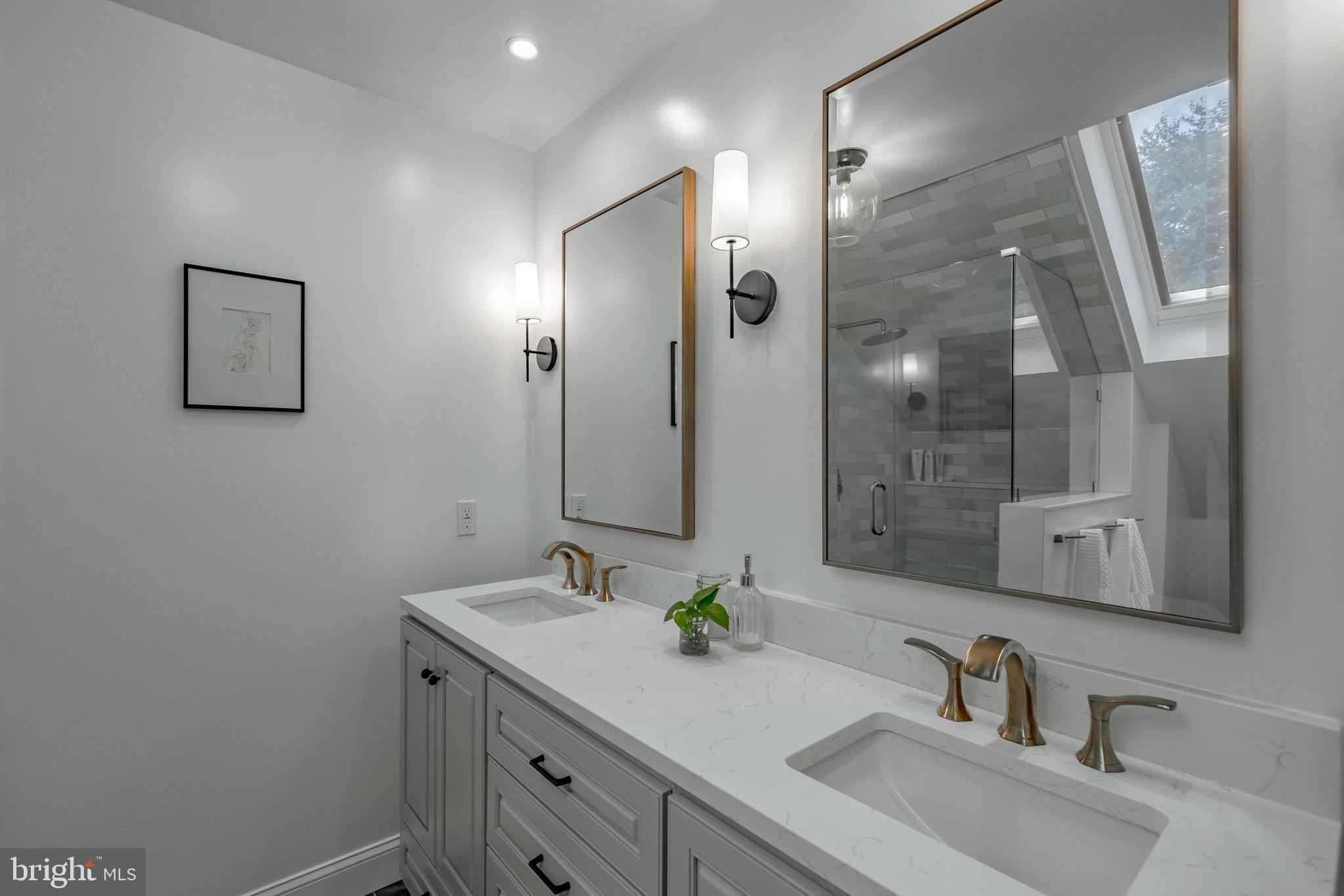 65 Roberts Road Newtown Square, PA 19073 - Photo 32 of 53 a bathroom with a sink and a mirror