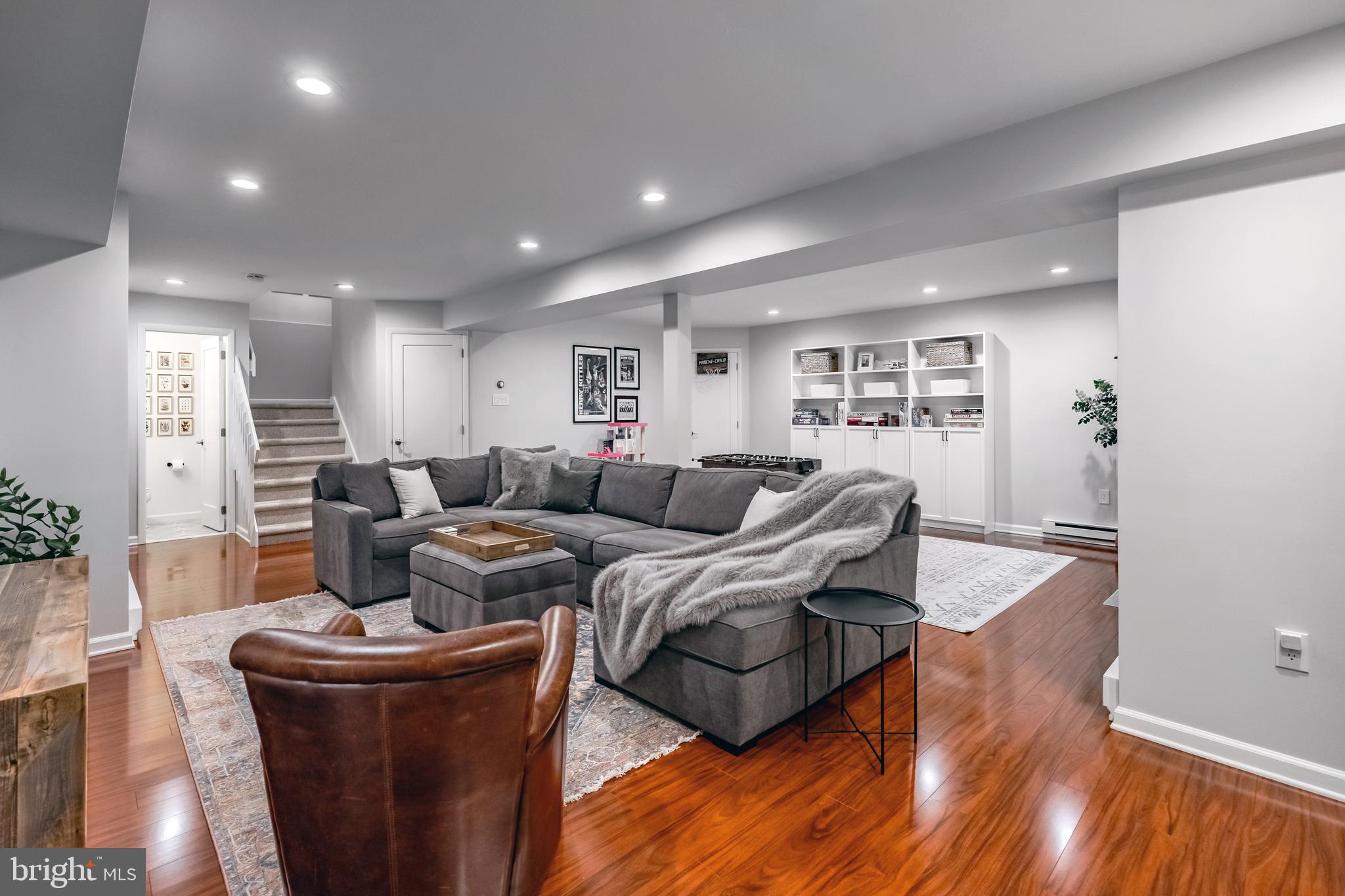 65 Roberts Road Newtown Square, PA 19073 - Photo 40 of 53 a living room with furniture and a wooden floor