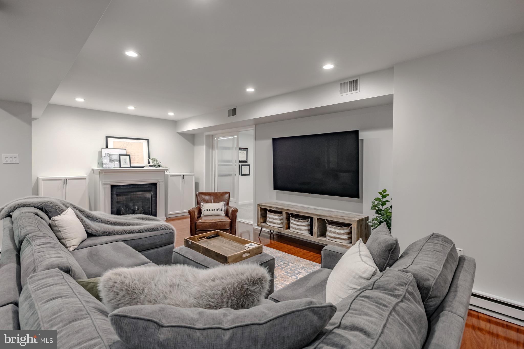 65 Roberts Road Newtown Square, PA 19073 - Photo 43 of 53 a living room with furniture and a flat screen tv