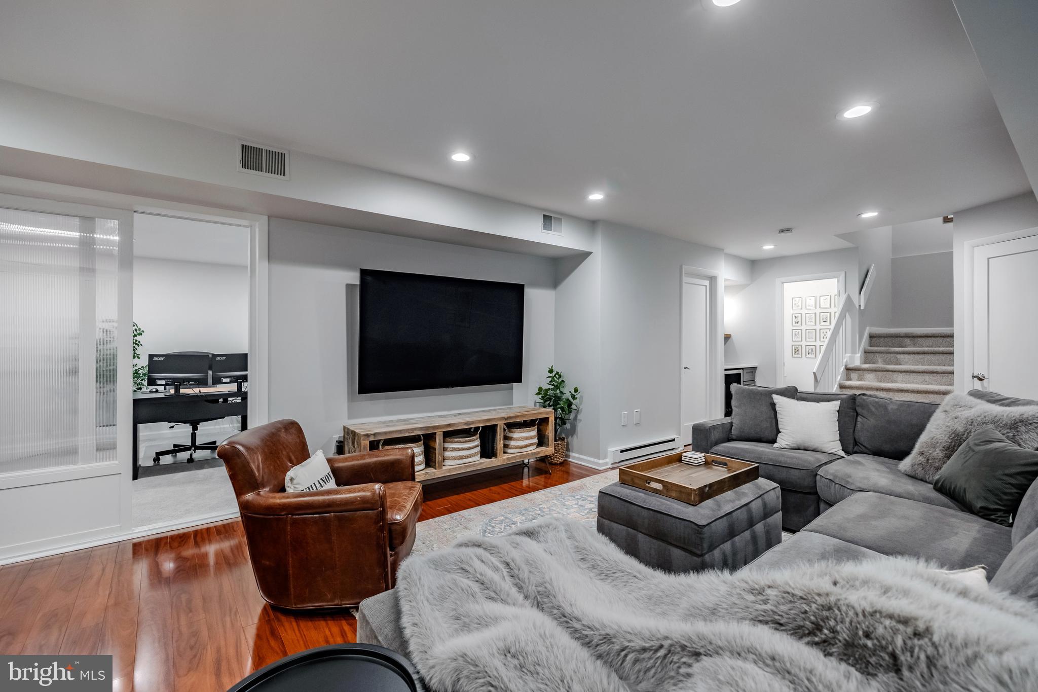 65 Roberts Road Newtown Square, PA 19073 - Photo 44 of 53 a living room with furniture and a flat screen tv