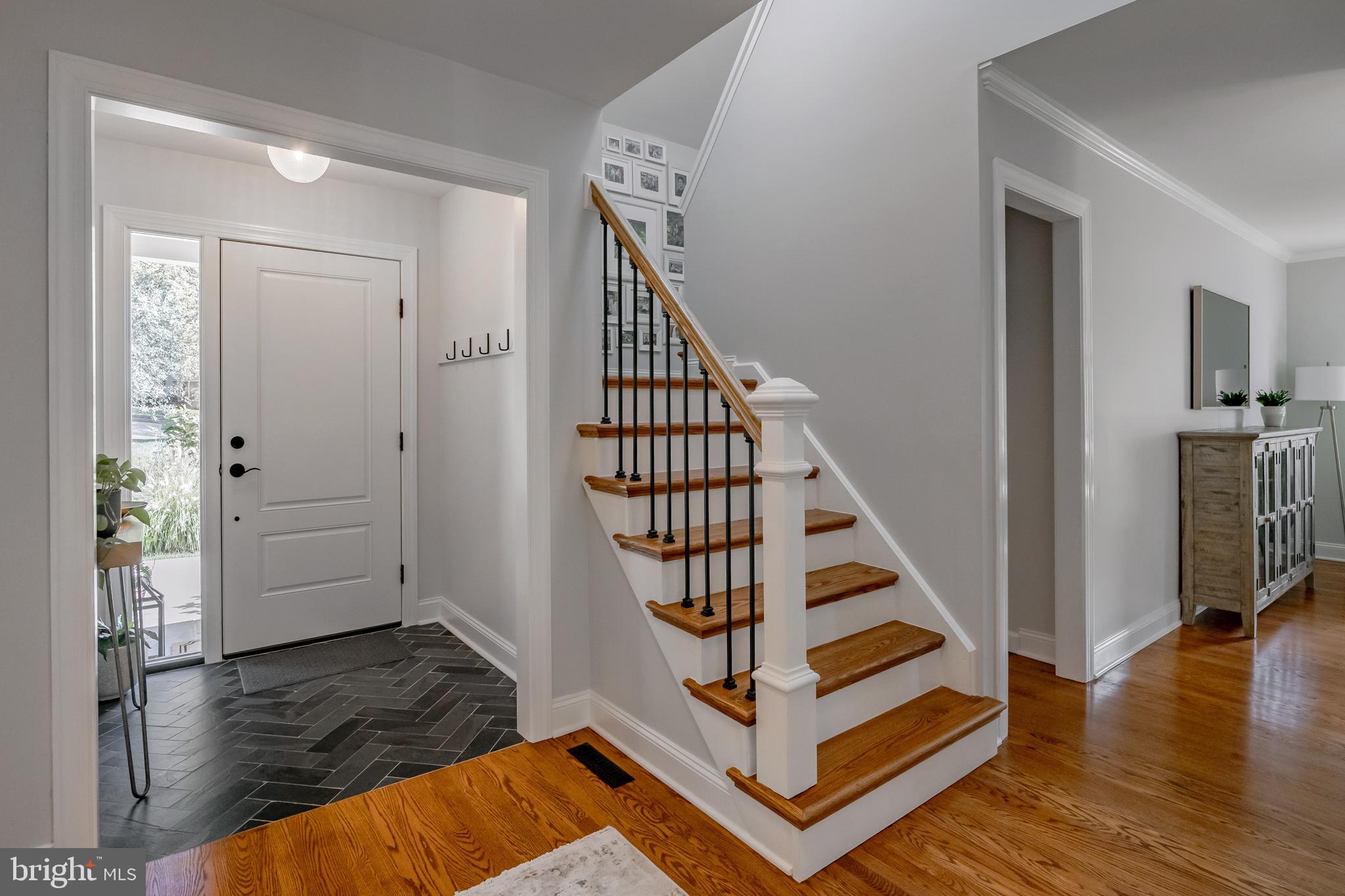 65 Roberts Road Newtown Square, PA 19073 - Photo 6 of 53 a view of a livingroom with wooden floor and staircase